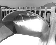 Photo. Hoover Dam Arizona Spillway.  Beneath the Arizona Bridge the spectacular view of Hoover Dam's Arizona Spillway.  Water flowing over the Arizona Spillway was 13,944 cubic feet per second and 4 1/2 feet above the Arizona Spillway gate.  7-22-83